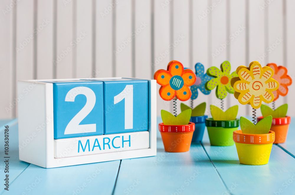 March 21th. Image of march 21 wooden color calendar with flower on white background.  Spring day