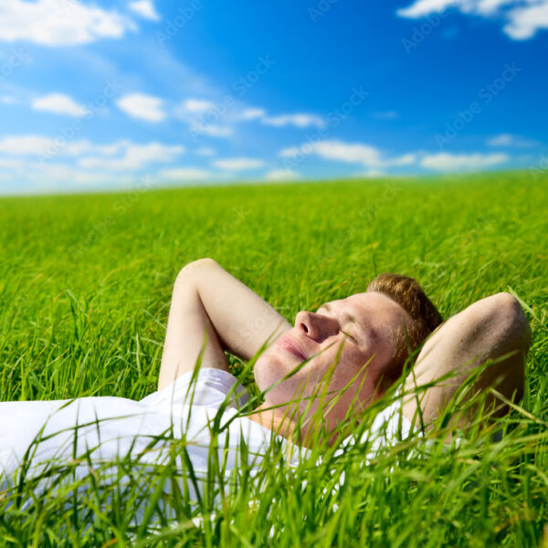 young man in grass