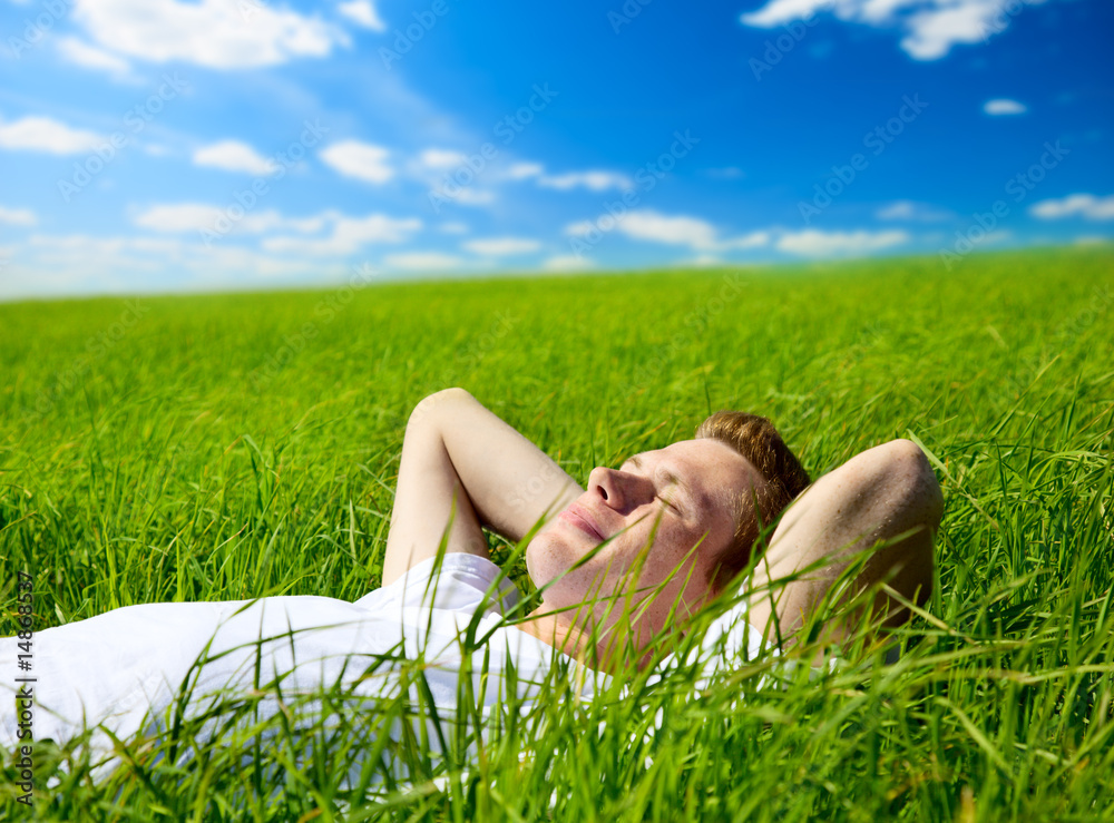 young man in grass